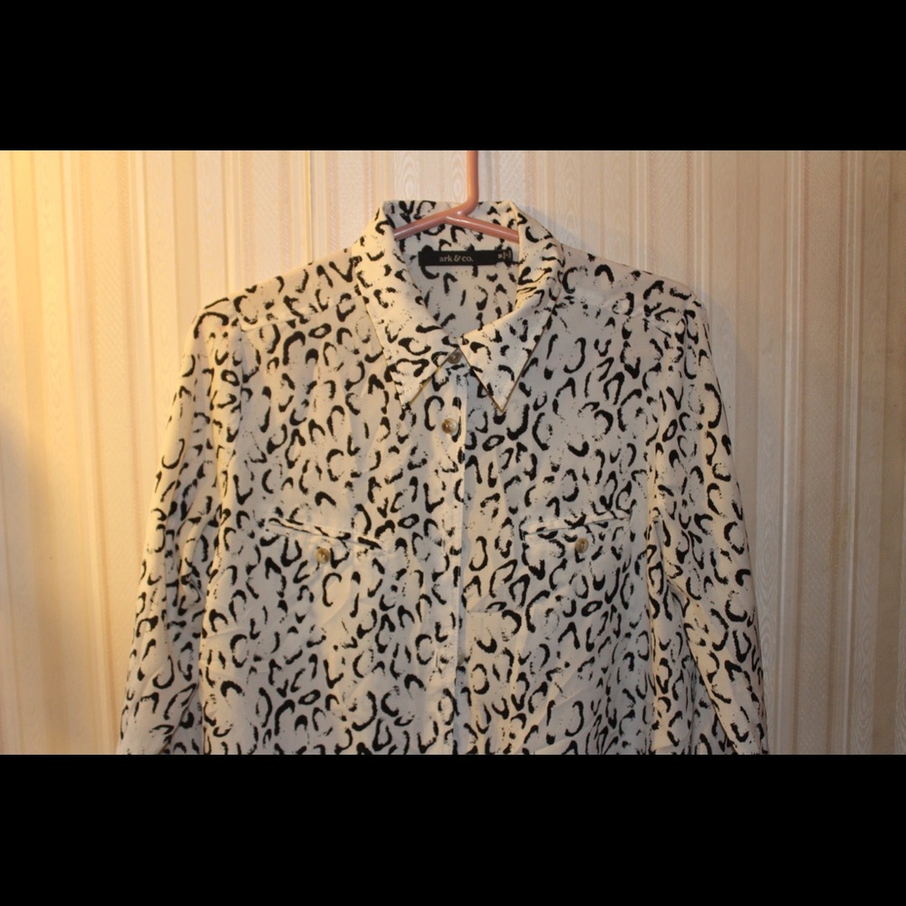 white blouse with black accent design
